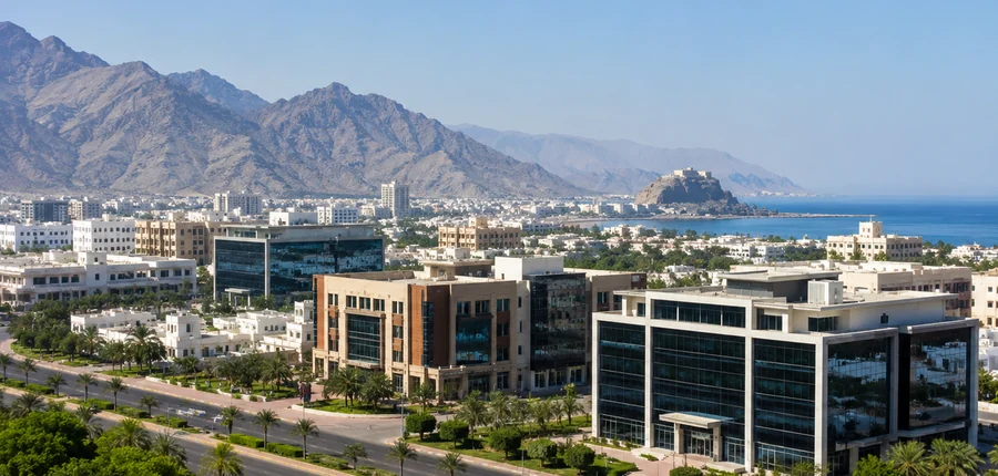Fujairah business district with mountains and coastline